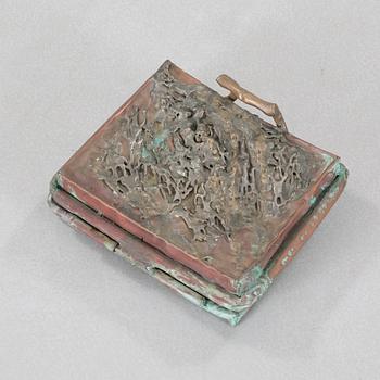 a metal sculpture, signed and dated -83.