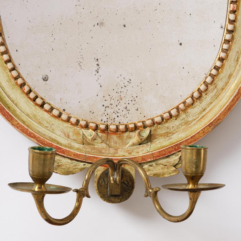 A pair of Gustaviantwo-branch giltwood girandole mirrors by C. G. Fyrwald (master in Stockholm 1776-1825).