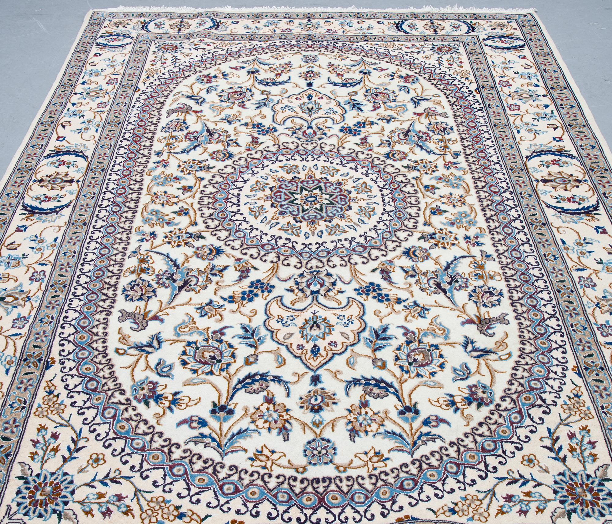 A carpet, Nain, part silk, ca 296 x 192 cm.