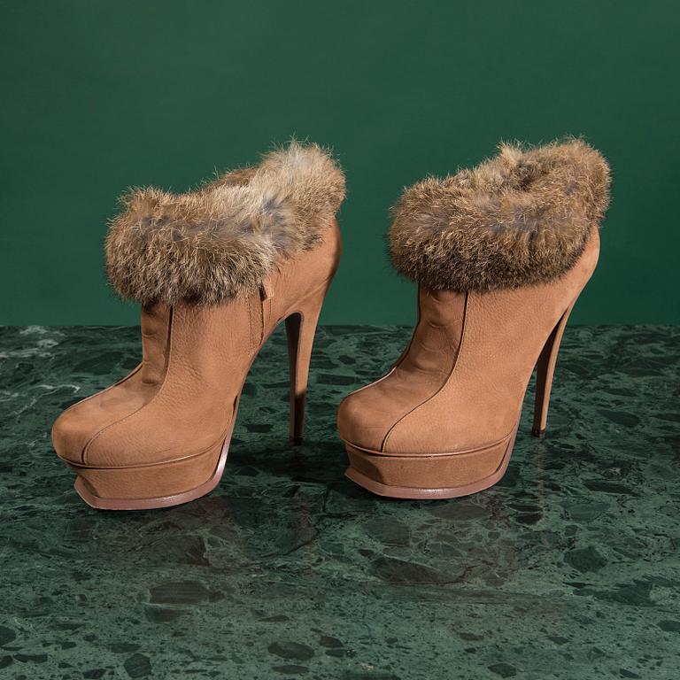 A pair of boots by YVES SAINT LAURENT,in size 37.