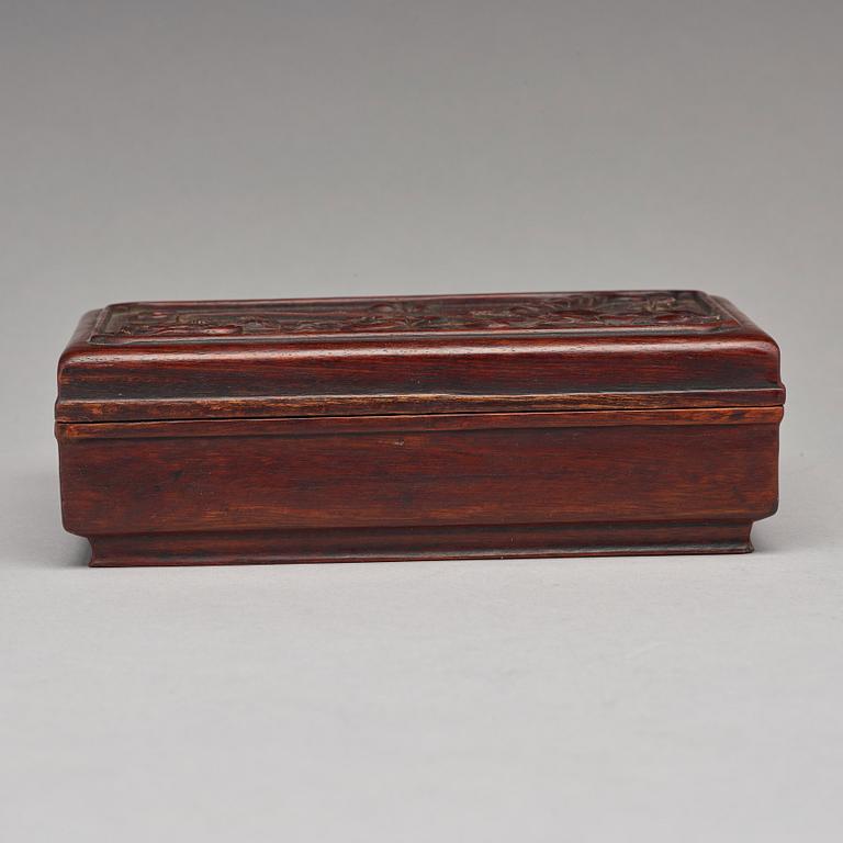 A Chinese wooden box, circa 1900.