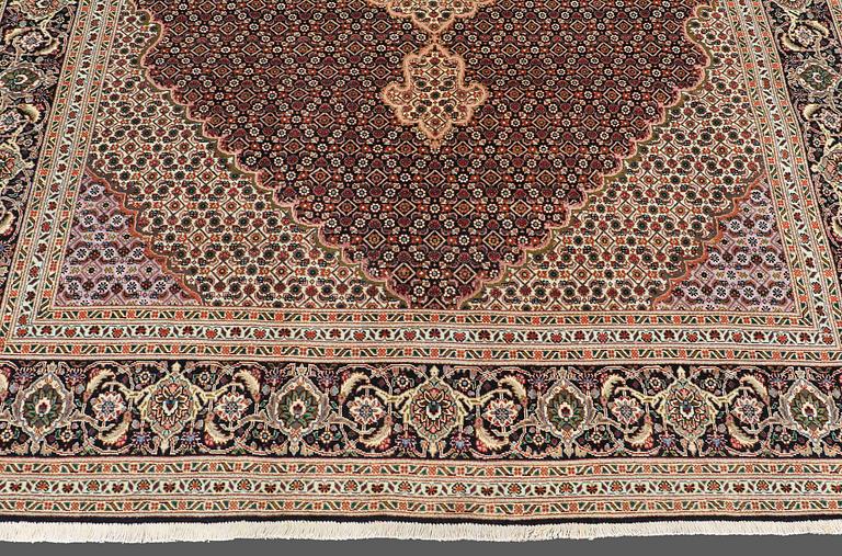 A CARPET, Tabriz part silk , so called 40 Radj, ca 298 x 202 cm.