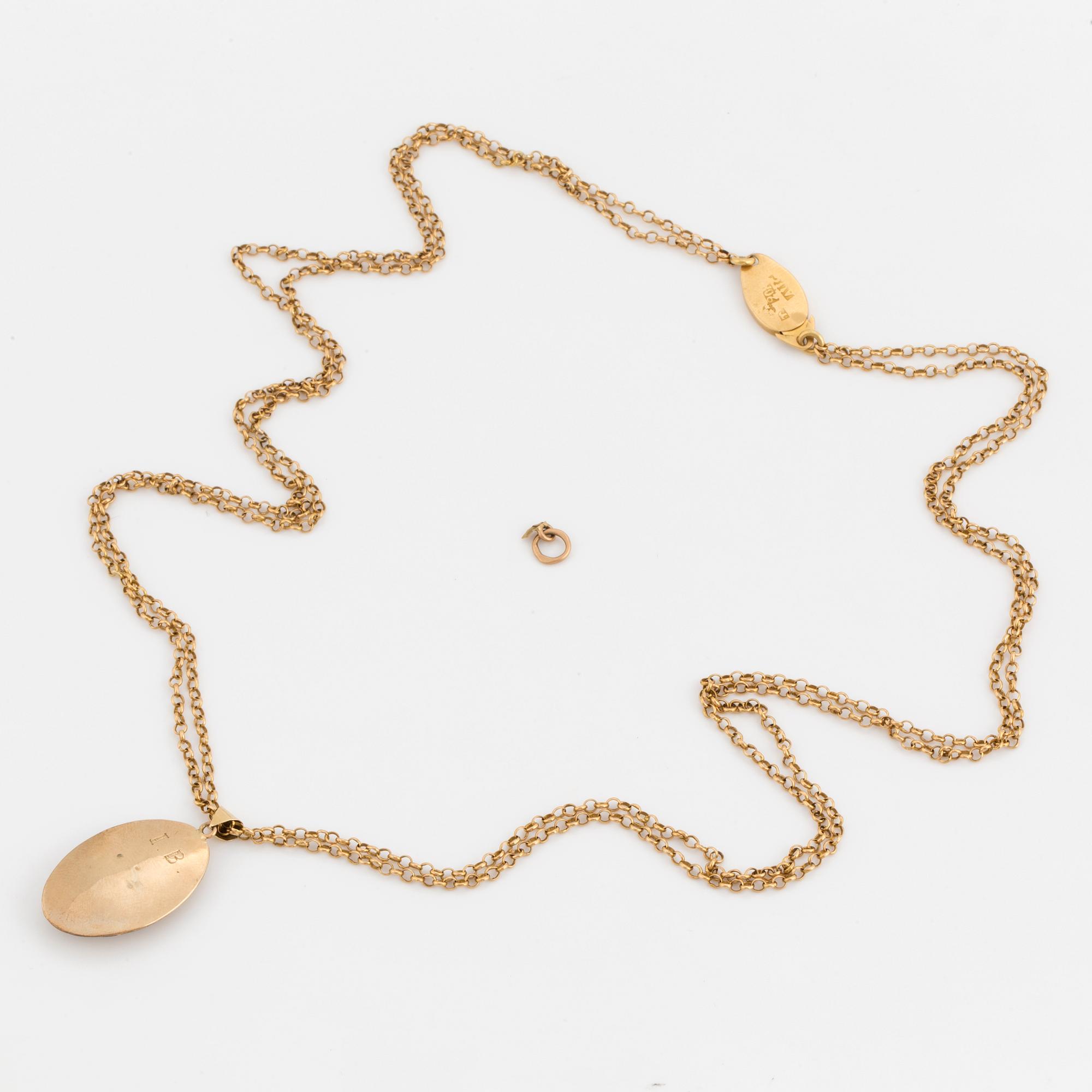 A chain and locket with hairwork.