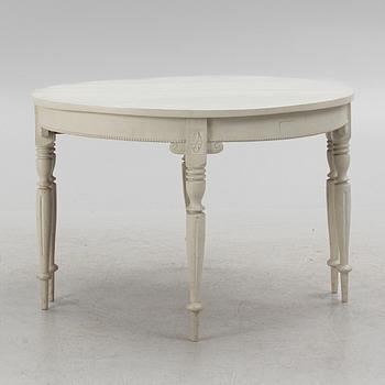 A late 19th Century painted dining table.