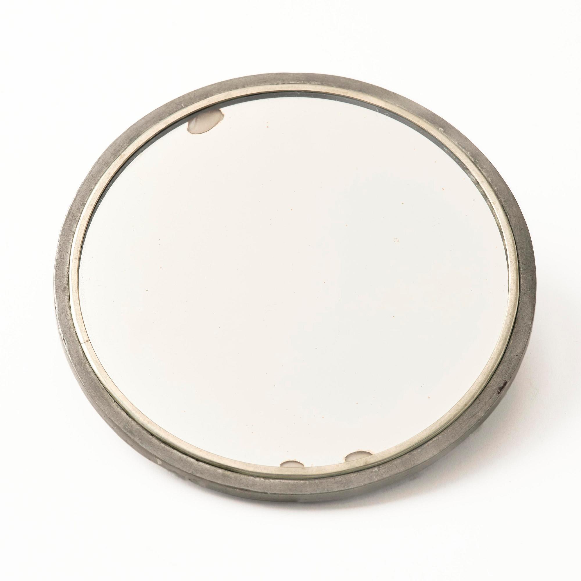 Firma Svenskt Tenn, a pewter hand mirror model A 1497 and a letter opener in the shape of an alligator, Stockholm, 1930s-40s.