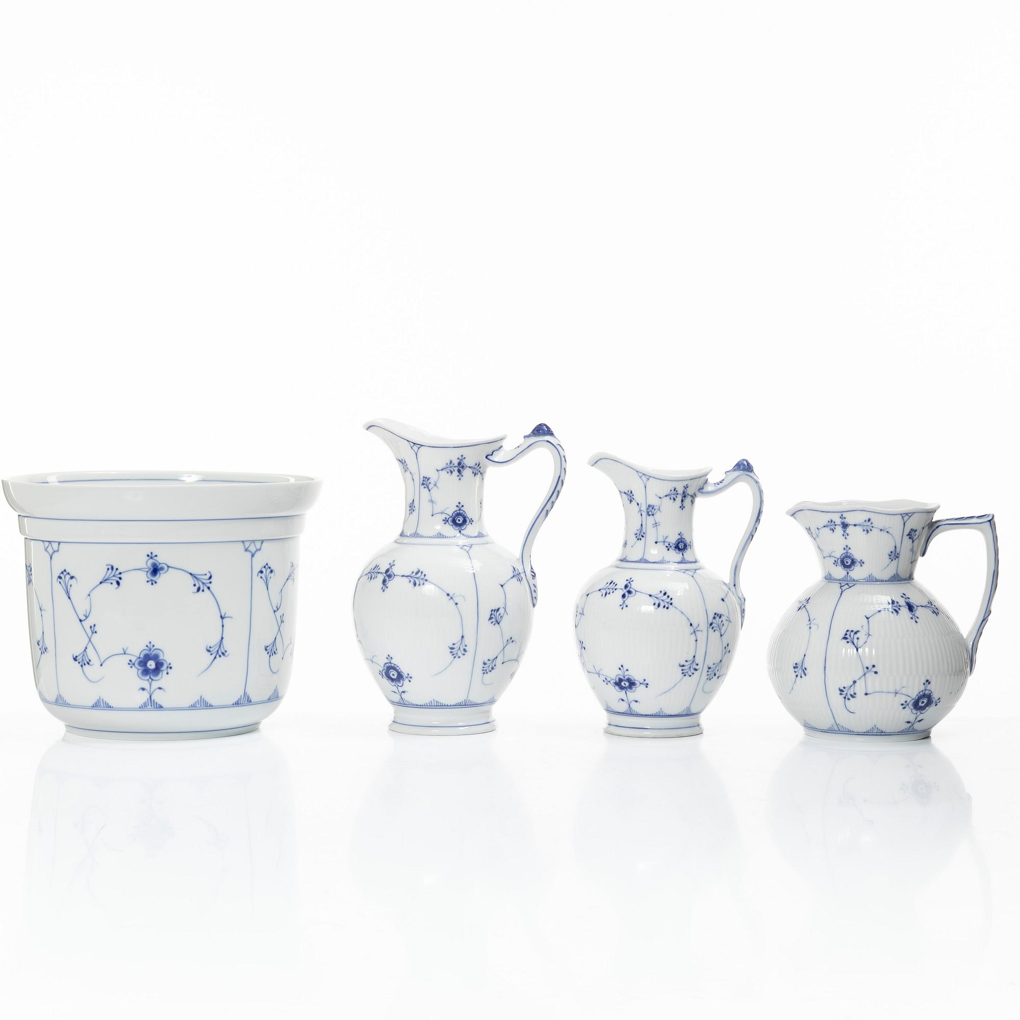 Royal Copenhagen, Three 'Musselmalet' jugs, circa 1900, and a Bing & Grøndahl cachepot, Denmark.