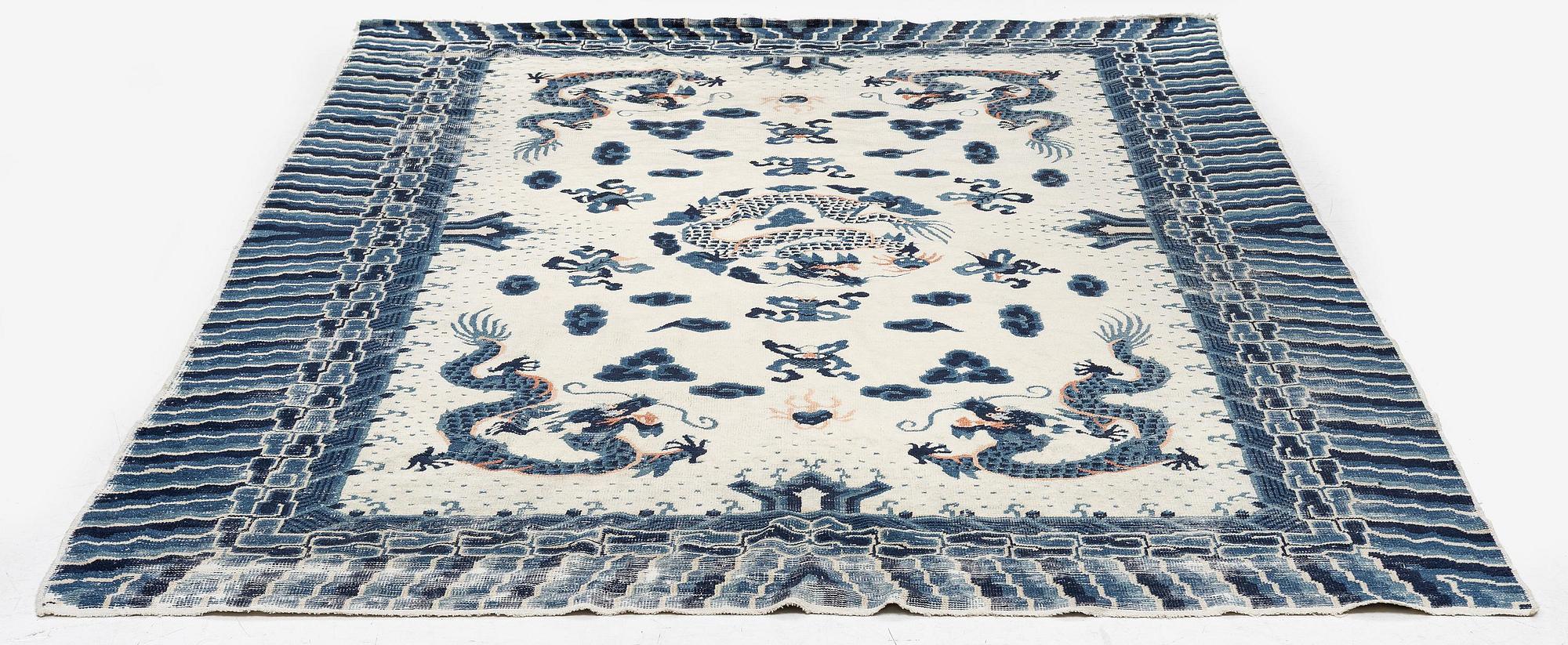 An antique Chinese ' five dragon rug', c. 280 x 190 cm.