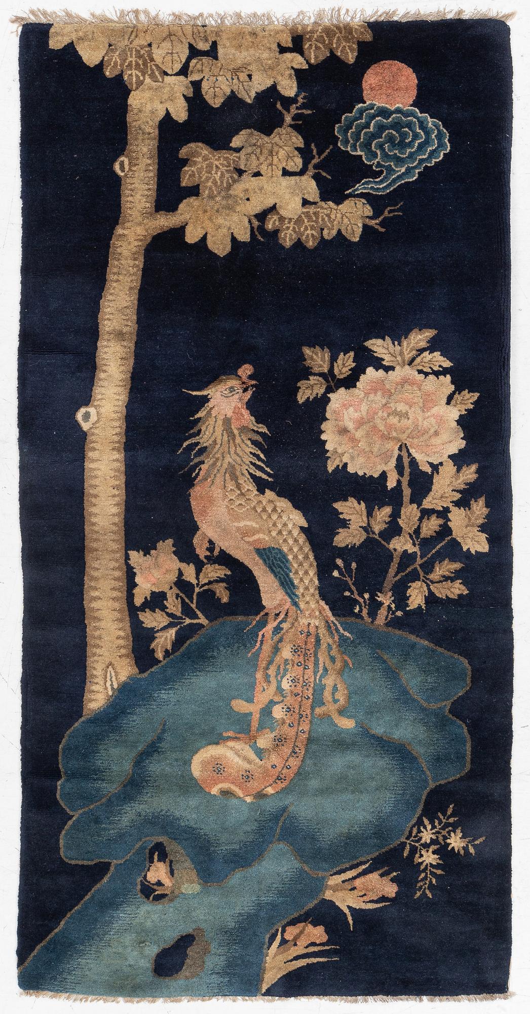 A Chinese ’phoenix rug’, 20th century, c. 181 x 93 cm.