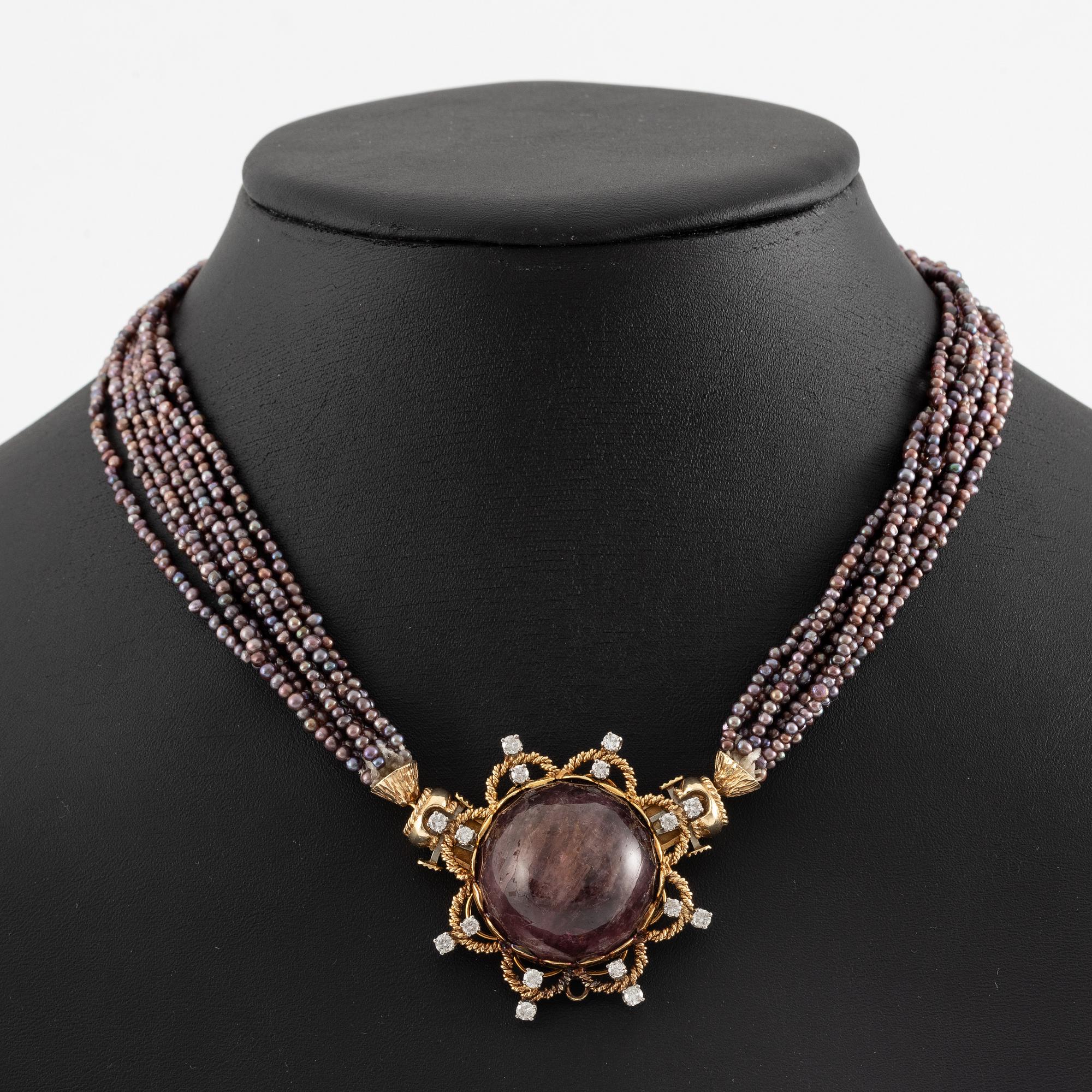 Multi-strand pearl necklace with two clasps set with carved coral, cabochon-cut tourmaline, and brilliant-cut diamonds.