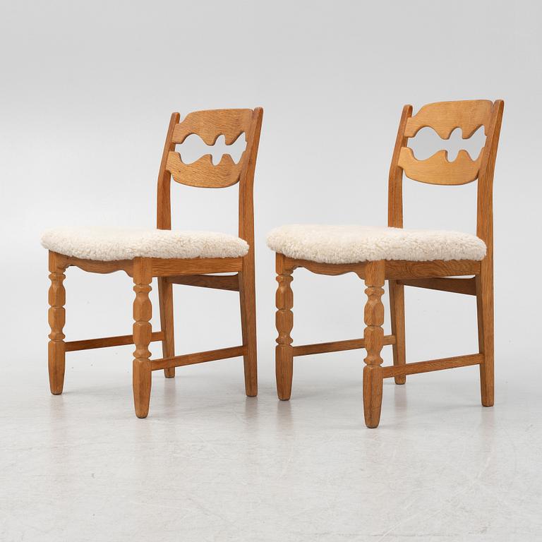 Henning Kjærnulf, a set of six oak 'razorblade' chairs, with new sheepskin upholstery, for EGK, 1960s.