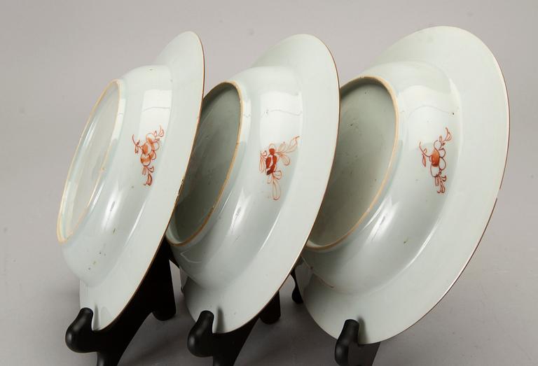 A set of four Chinese famille rose Qianlong porcelain plates.