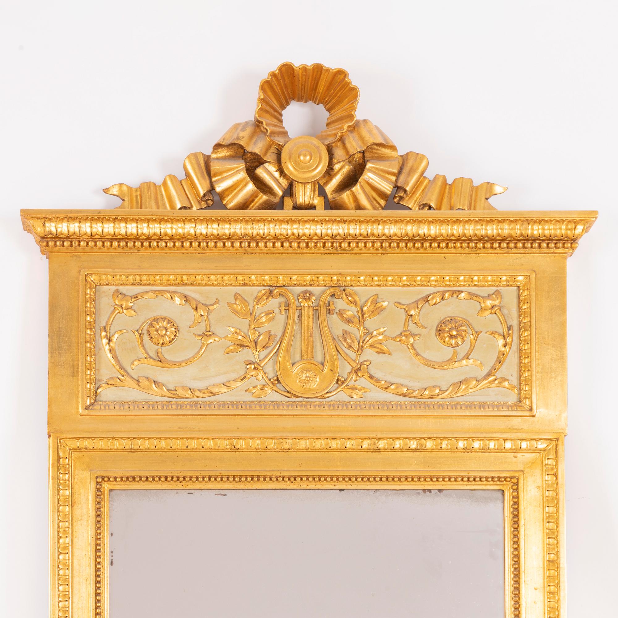 A late-Gustavian giltwood mirror, Stockholm, late 18th century.