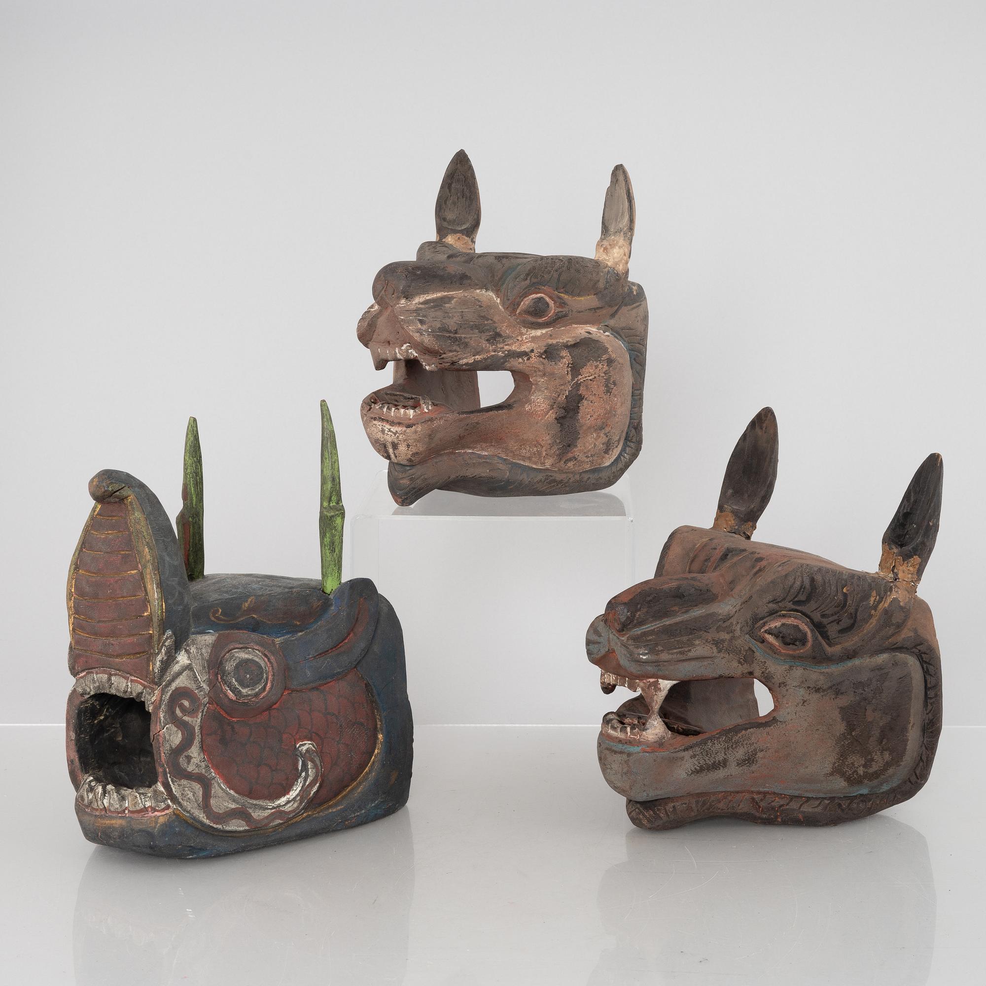 Four Tibetan/South East Asian wooden decorations, 20th century.