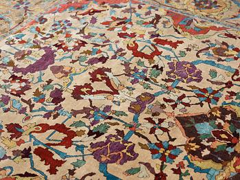 A RUG. An antique silk Kashan so called Motachem. 202,5 x 136,5 cm.