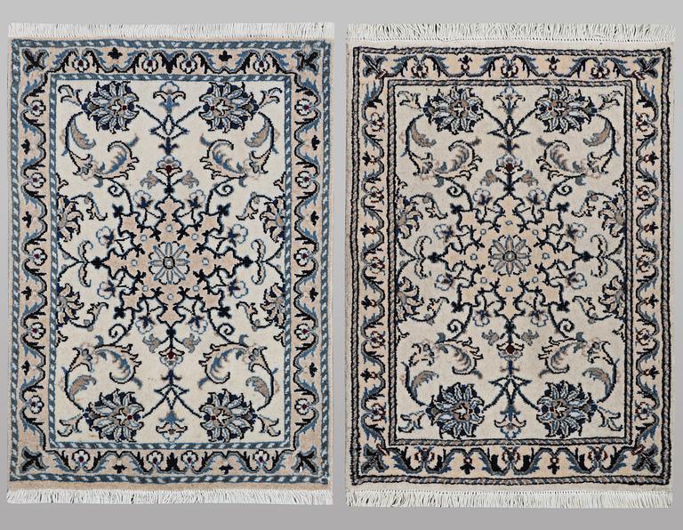 A pair of rugs, Nain, part silk, ca 80 x 60 cm 
 & ca 83 x 58 cm.