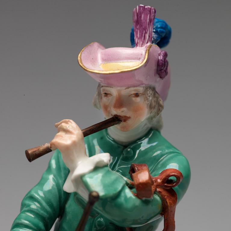 A Meissen figure of a musician, 18th Century.