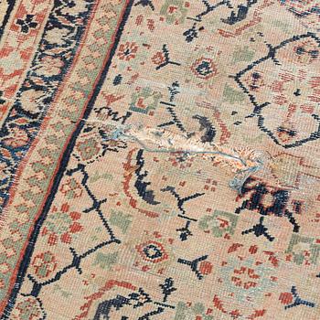 An oriental, semi-antique carpet, c. 415 x 365 cm.