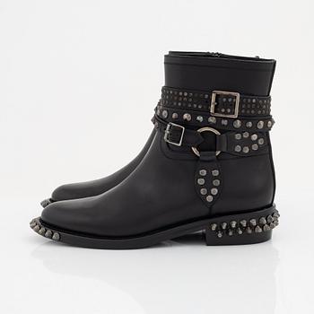 Yves Saint Laurent, a pair of black leather and studs boots, size 38.