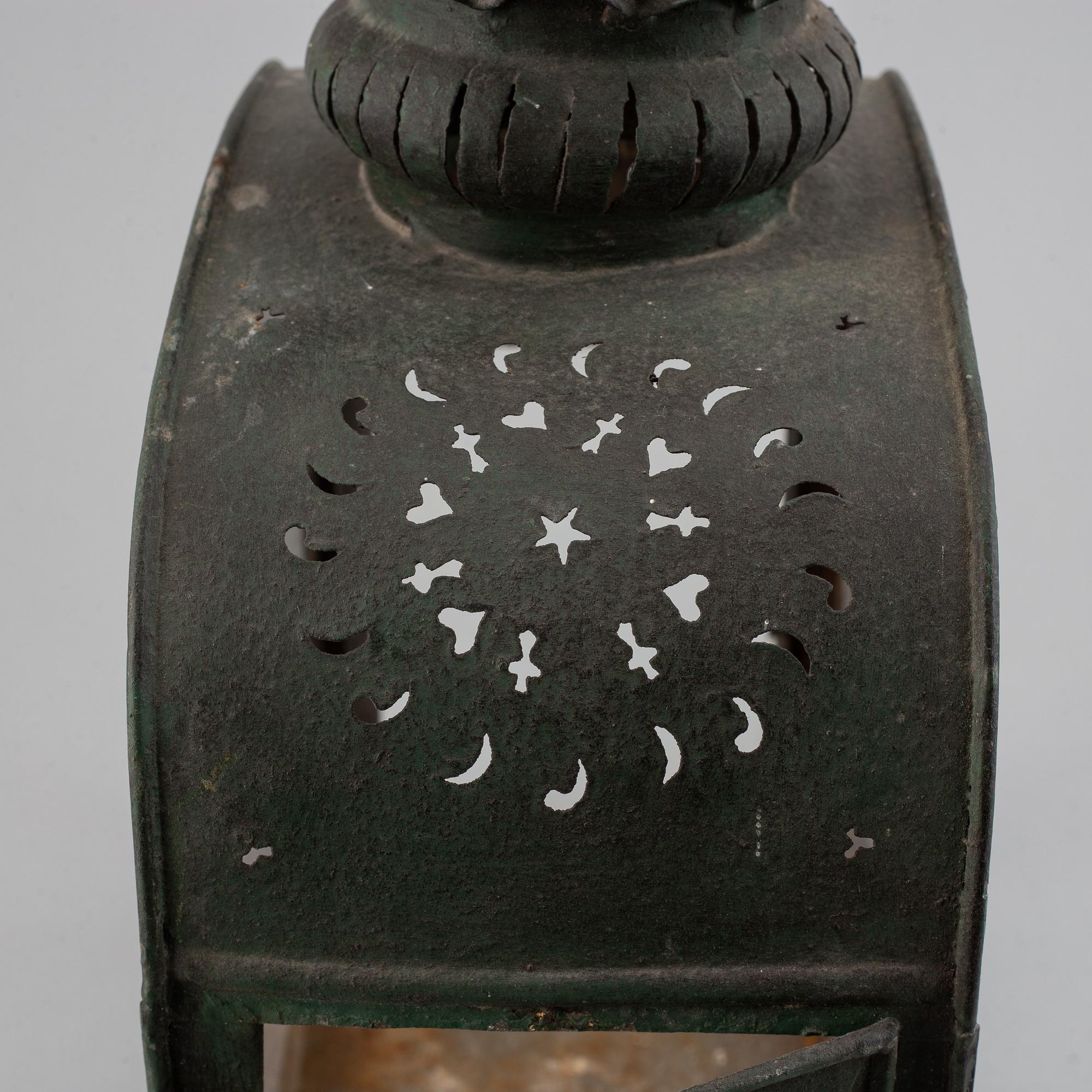 An 18th century tinplate and glass lantern.