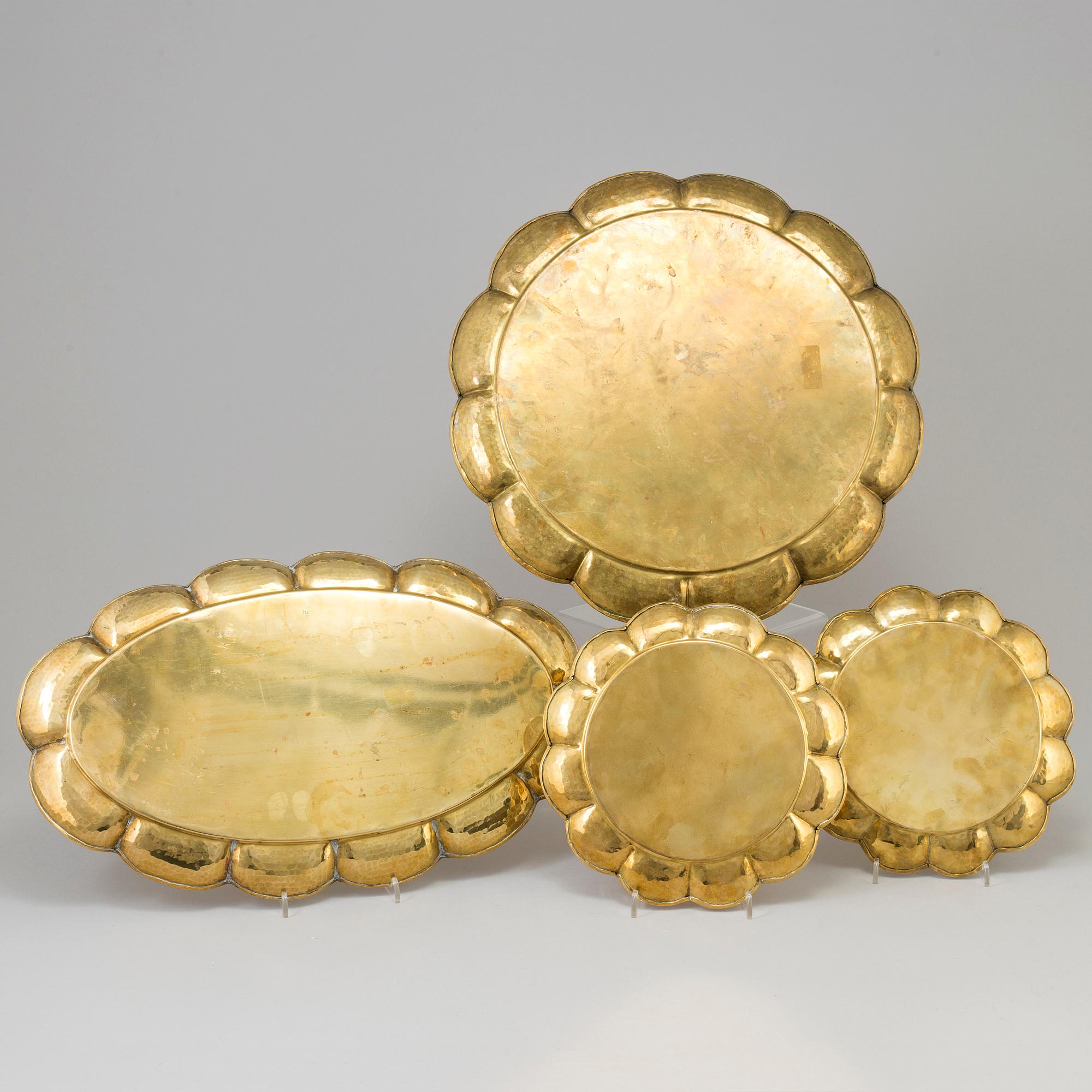 A set of four brass plates by Ture Henrikson, Arvika.