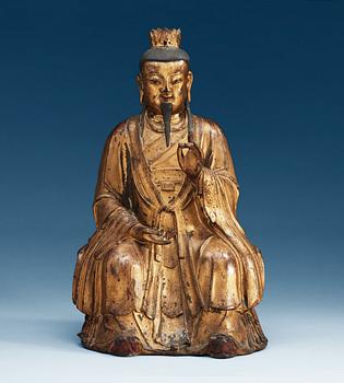 A gilt bronze figure of a High Daoist official, Ming dynasty.