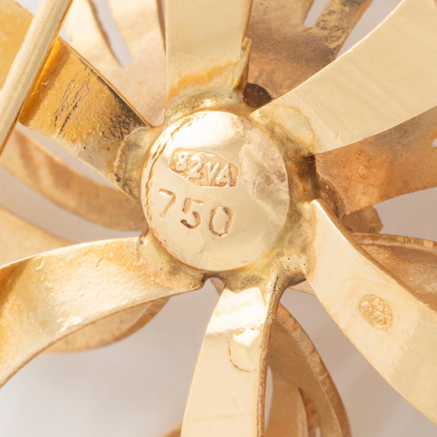 Brosch 18K guld med rosa stenar.