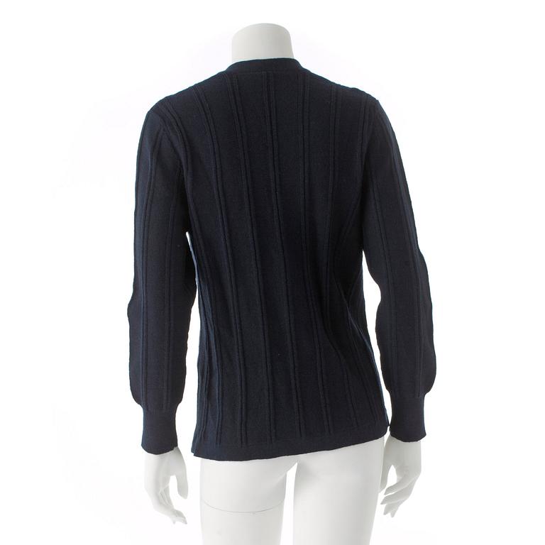 CÉLINE, a dark blue wool cardigan.