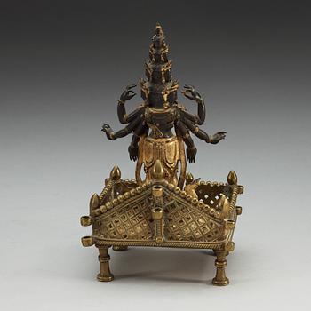 A gilt bronze figure of eleven-faced Avalokiteshvara, Tibet/Nepal, 19th Century.