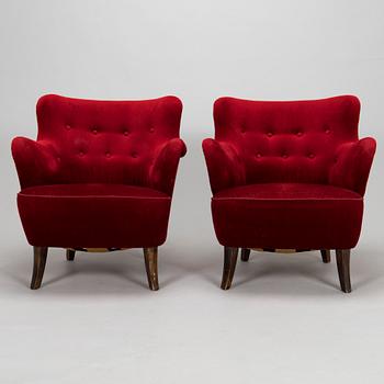 A pair of mid-20th-century armchairs.