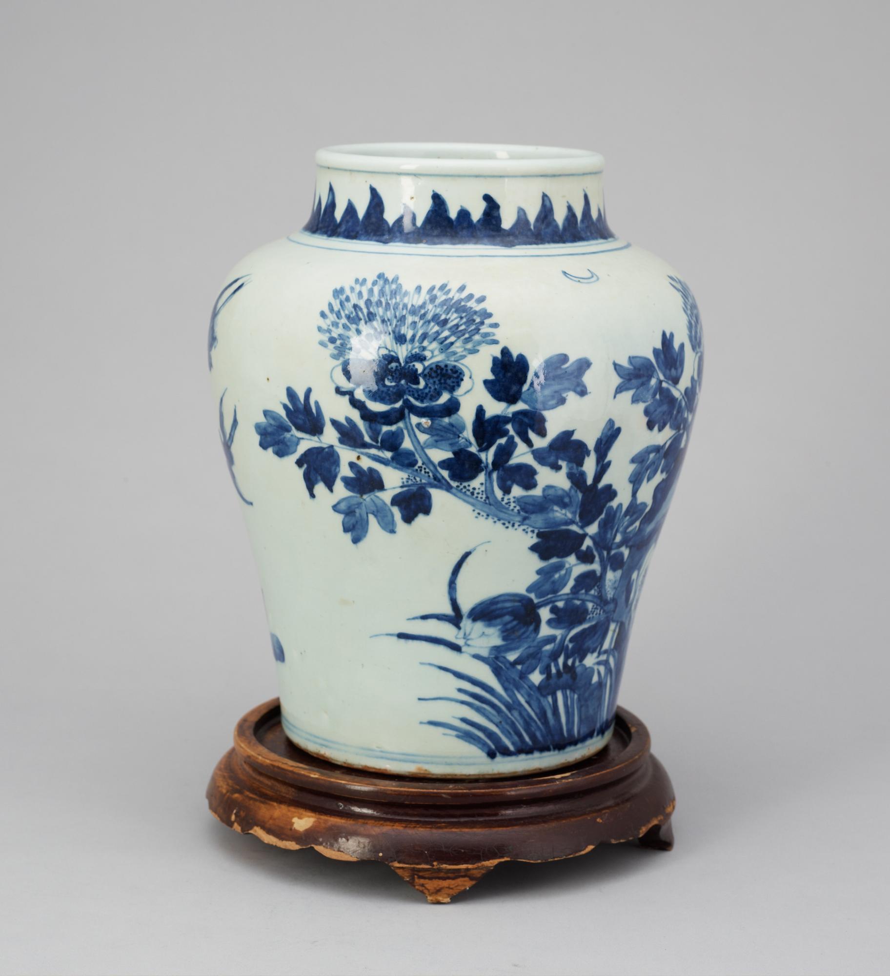 A blue and white Qing dynasty urn.