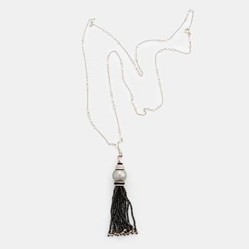 An Ebba Brahe 18K white gold tassel pendant with a cultured Tahitian pearl and white and black diamonds.