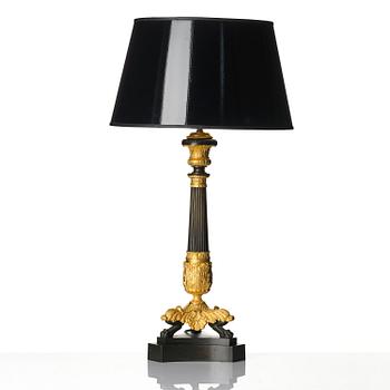 A French Louis Philippe ormolu and patinated bronze lamp, first part 19th century.