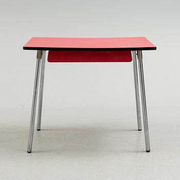 A mid 20th century table and chair.