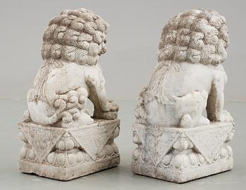 A pair of marble figures of 'Buddhist Lions', China.