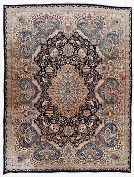 An oriental carpet, circa 390 x 302 cm.