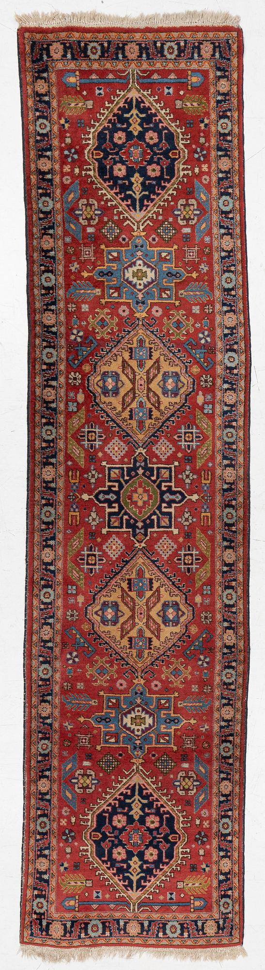 A semi-antique Kurdish runner, 350 x 140 cm.