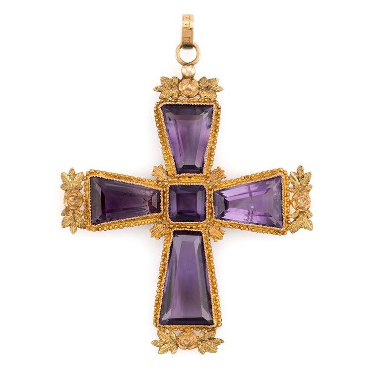 An 18K gold cross with amethysts with a 23K gold chain.