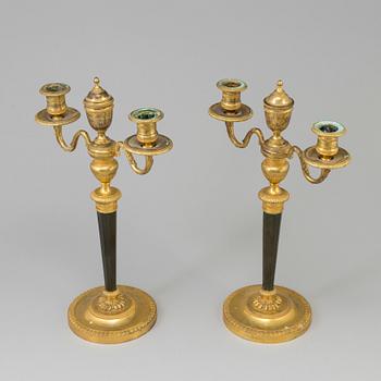 A pair of French Directoire late 18th century ormolu candelabra for three candles.