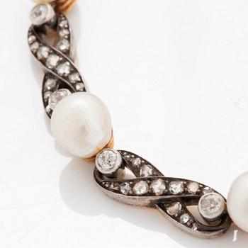 A bracelet in 18K gold and silver set with pearls and old- and rose-cut diamonds.