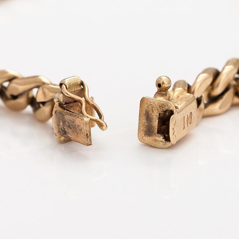 A 14K gold bracelet.