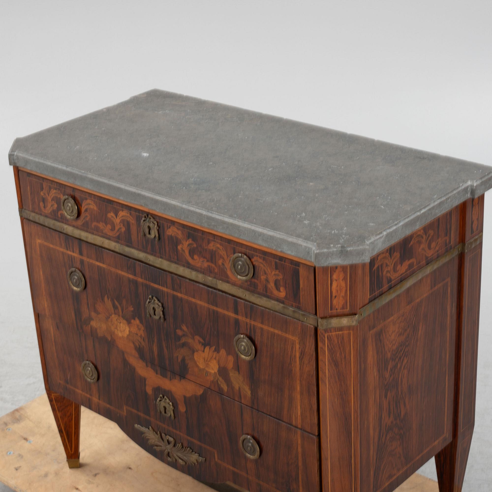 A Gustavian style chest of drawers, early 20th century.