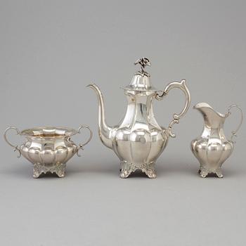 A three piece silver coffee set dated 1916-17.