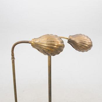 A set of two brass floor lamps later part of the 20th century.