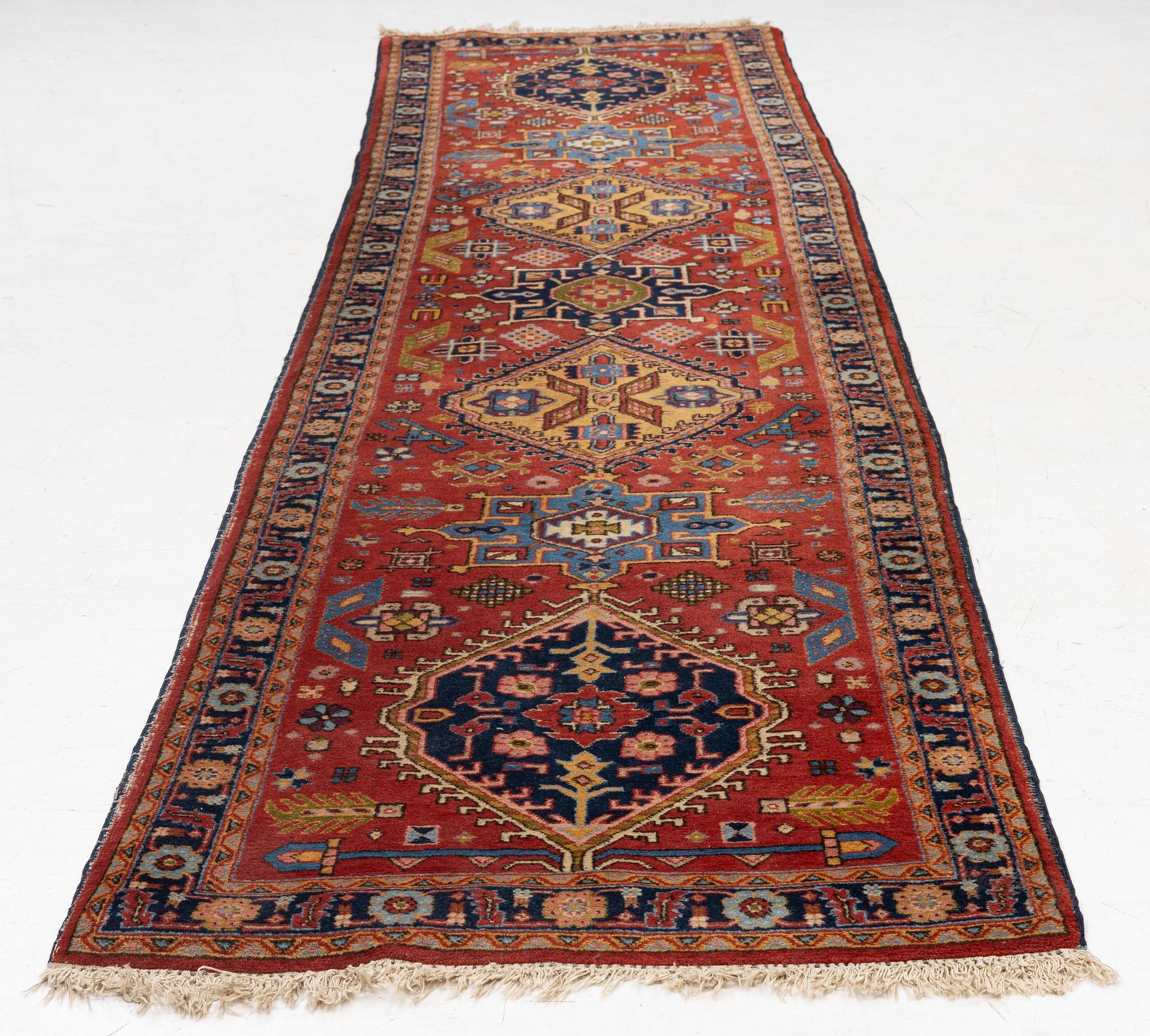 A semi-antique Kurdish runner, 350 x 140 cm.