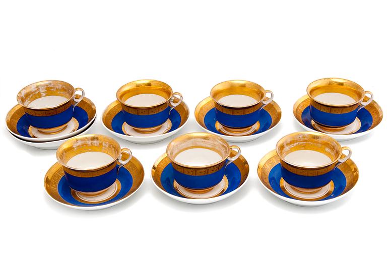 A SET OF SIX CUPS AND SAUCERS.