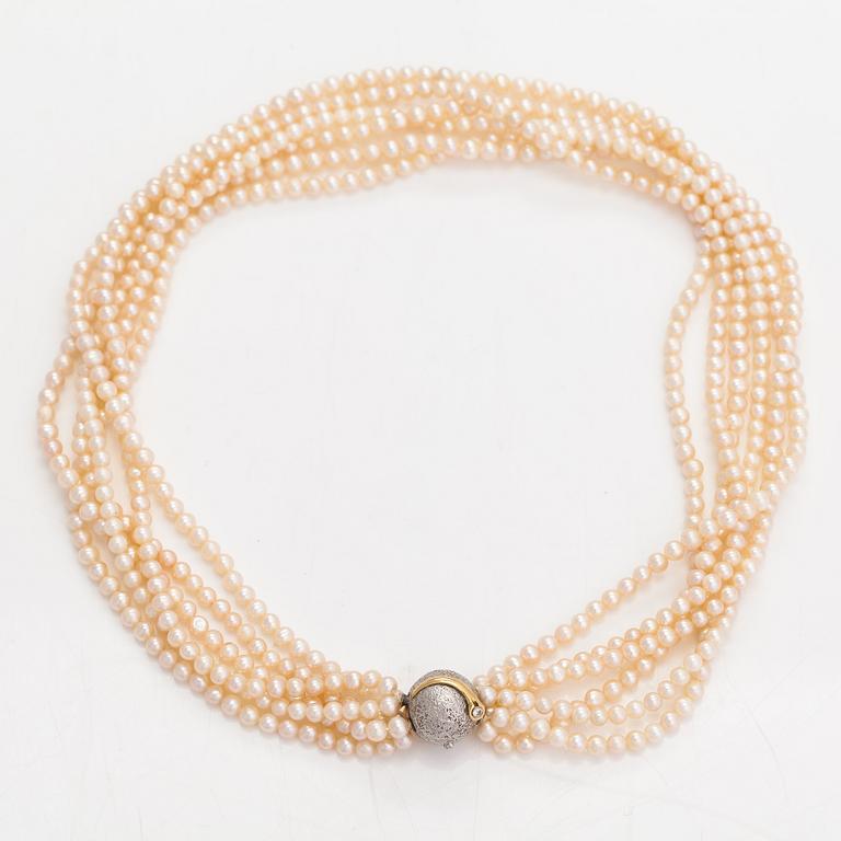 Ole Lynggaard, A 6-strand pearl collier, 14K gold, diamonds ca. 0.08 ct in total and cultured pearls. Denmark.