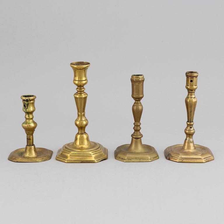 Four 18th century bronze candlesticks.