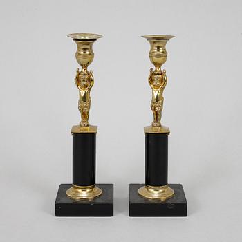 A pair of late gustavian candlesticks, circa 1800.