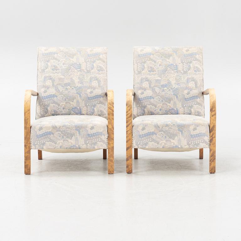 A pair of 1930's armchairs.