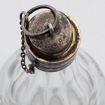 A pair of late gustavian glass and silver vinegar bottles, circa 1800.